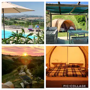 Zelt auf dem Campingplatz mit Terrasse, Holzkisten, Sitzbank und Blick auf den Pool und die grüne Landschaft.