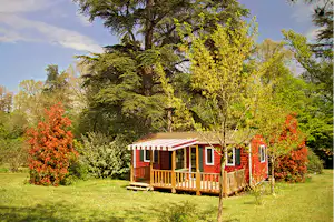 Camping Château Le Haget - Mobilheim mit Veranda auf dem Campingplatz