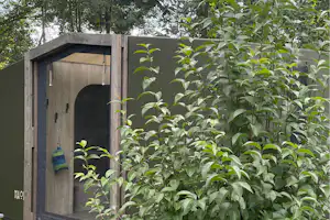 Camping Le Moulin du Bleufond - Mobilheim mit Veranda auf dem Campingplatz
