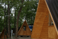 Camping Le Rossane - Mobilheime als Holtzhütte auf dem Campingplatz