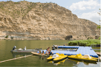 Camping PortMassaluca - Kajak fahrende Gäste auf dem Fluss auf dem Campingplatz