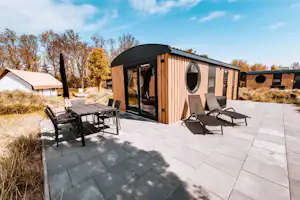 Camping Strandparadies - Mobilheim mit Terrasse auf dem Campingplatz