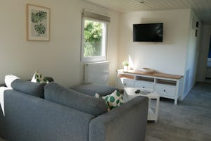 Campingpark Münsterland Eichenhof - Wohnraum in Ferienwohnung auf dem Campingplatz