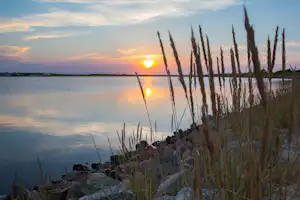 Campingplatz Zur Perle - Blick auf die Lagune bei Sonnenuntergang