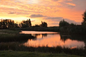 Landschapscamping Kijkuit - Sonnenuntergang über dem Wasser