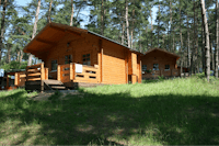Natur Camping Usedom - Blockhäuser auf der Wiese