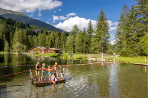 TCS Camping Disentis TCS-Camping Disentis - Badeteich auf dem Campingplatz